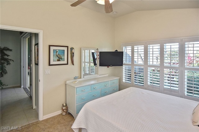 tiled bedroom with vaulted ceiling and ceiling fan