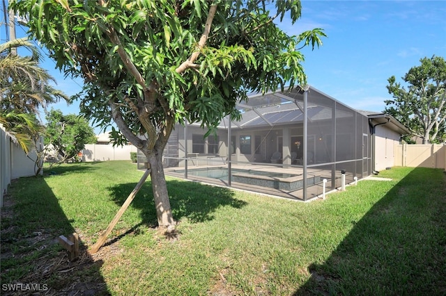 view of yard with a fenced backyard, a patio area, a lanai, and a fenced in pool