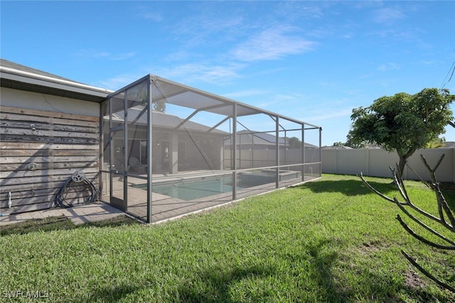 exterior space featuring a lanai, a fenced backyard, and a fenced in pool