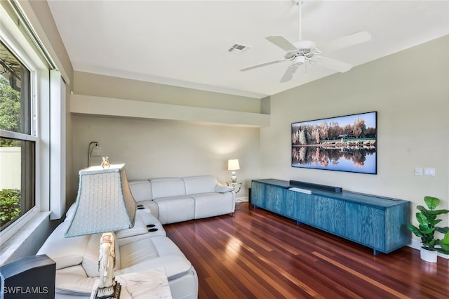 living room featuring dark wood-style floors, ceiling fan, and visible vents