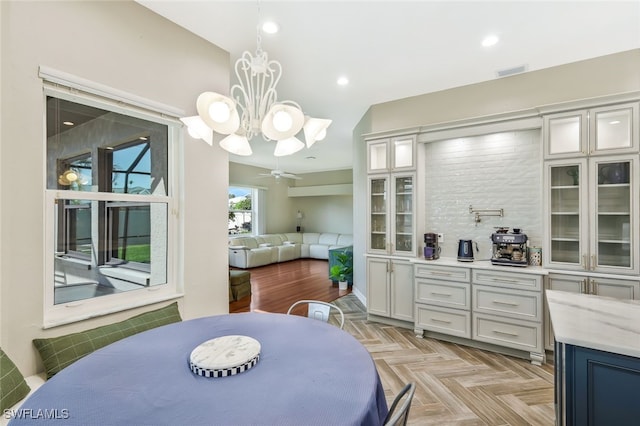 dining area featuring a chandelier, recessed lighting, and visible vents