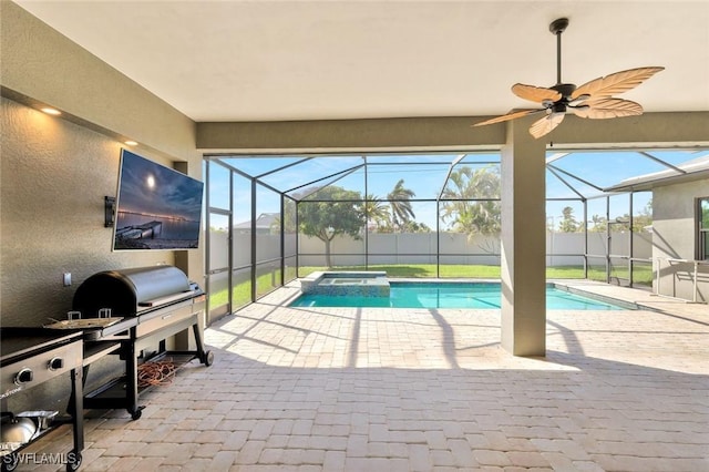 view of pool featuring glass enclosure, a patio, fence, and a pool with connected hot tub