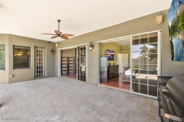 view of patio / terrace featuring ceiling fan