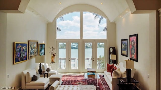 doorway with a towering ceiling and french doors