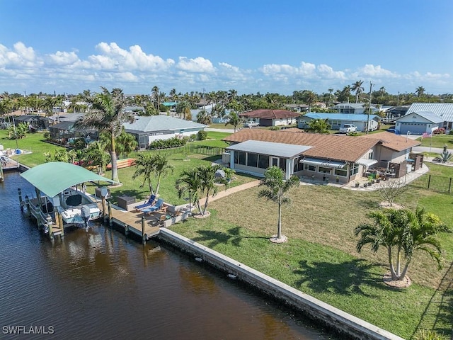 bird's eye view with a residential view and a water view