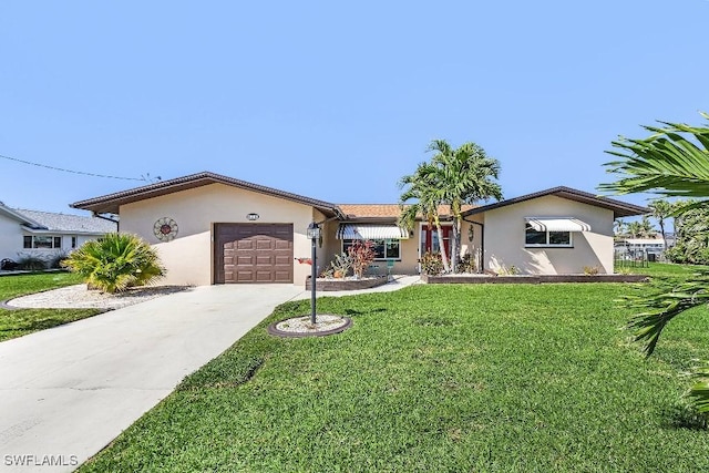 ranch-style home with a garage, stucco siding, concrete driveway, and a front yard