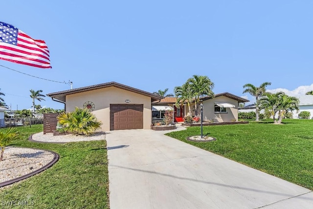 view of front facade featuring an attached garage, fence, concrete driveway, stucco siding, and a front yard