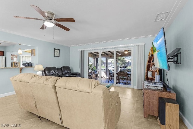 living area featuring baseboards, ceiling fan, visible vents, and crown molding