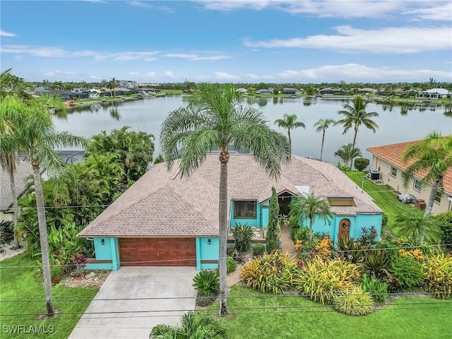 drone / aerial view with a water view