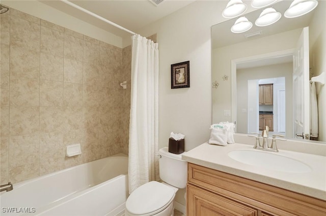 bathroom with toilet, visible vents, shower / tub combo with curtain, and vanity