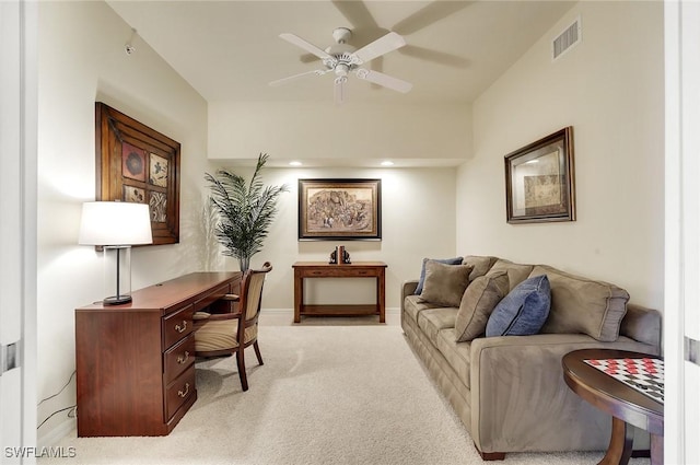 home office featuring light carpet, baseboards, visible vents, and a ceiling fan