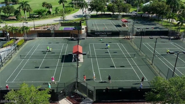 view of sport court with fence