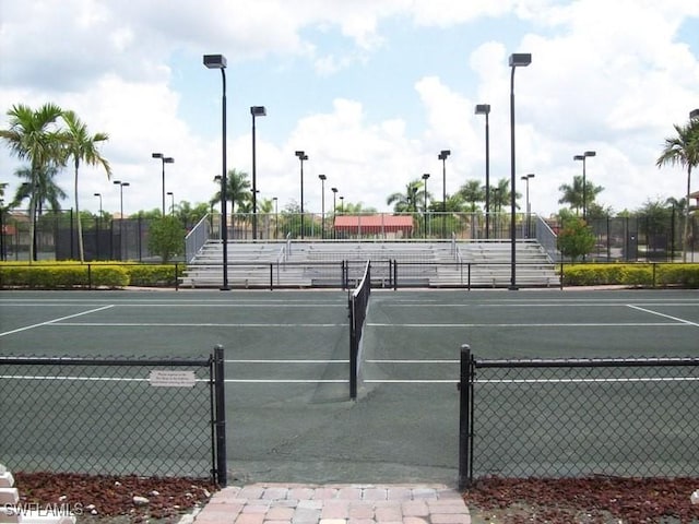 view of tennis court with fence