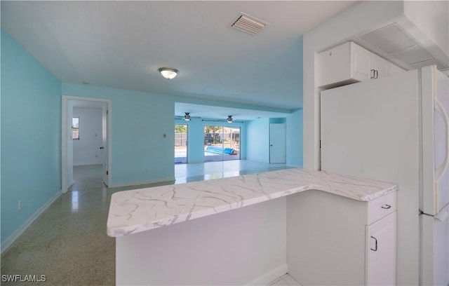 office area featuring visible vents and baseboards