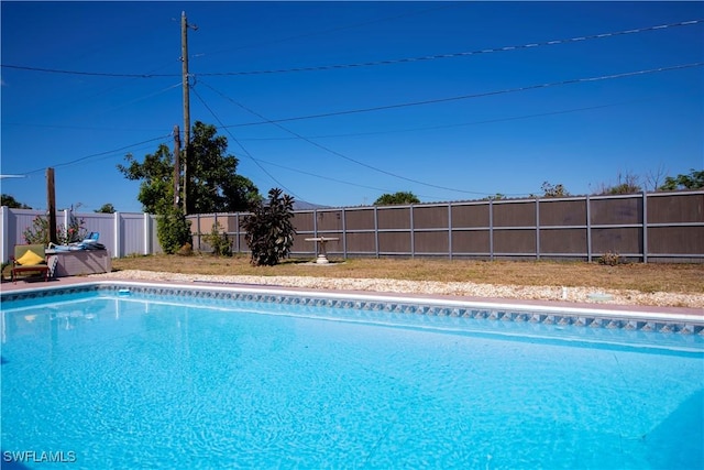 view of pool featuring a fenced in pool and a fenced backyard