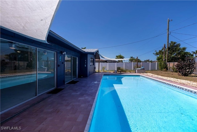 view of pool with a fenced backyard and a fenced in pool