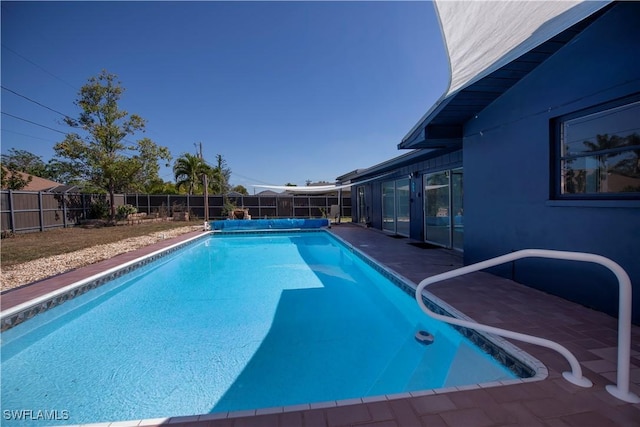 view of swimming pool with a fenced backyard and a fenced in pool