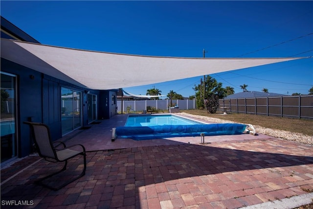 view of pool featuring a patio area, a fenced backyard, and a fenced in pool