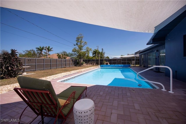 view of pool featuring a fenced in pool, a fenced backyard, and a patio