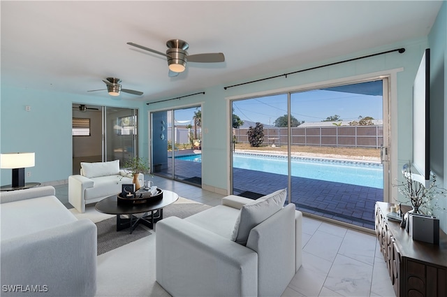 living area with ceiling fan