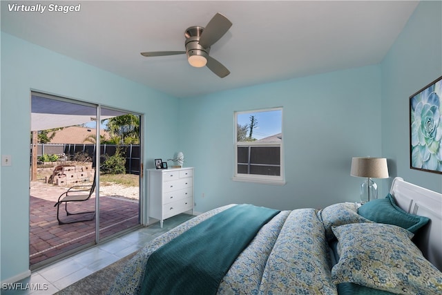 bedroom with access to exterior, a ceiling fan, multiple windows, and light tile patterned floors