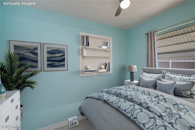 bedroom featuring a ceiling fan and baseboards