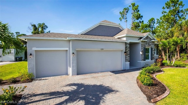 view of front of home with a garage and a front yard