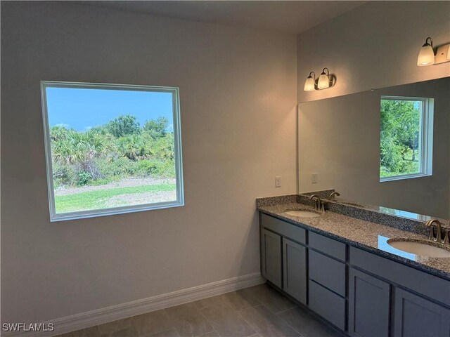 2211 Harbour Dr, Punta Gorda, FL 33983 - full bath featuring plenty of natural light, double vanity, and baseboards