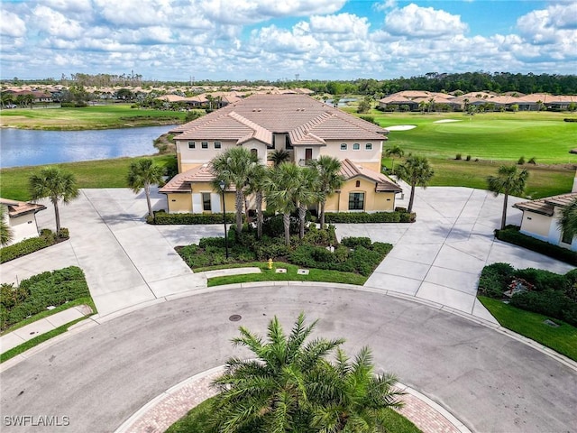 bird's eye view featuring a water view and golf course view