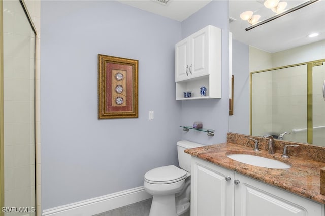bathroom with toilet, tiled shower, baseboards, a chandelier, and vanity