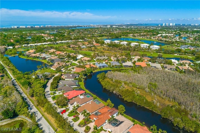 bird's eye view featuring a residential view and a water view