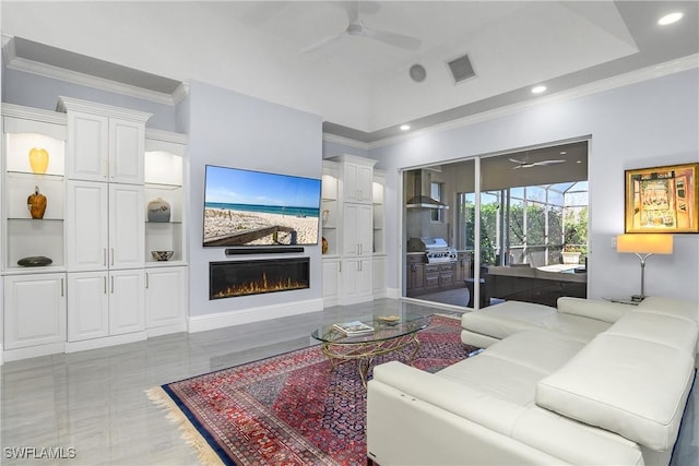 living room with a lit fireplace, crown molding, visible vents, and a ceiling fan