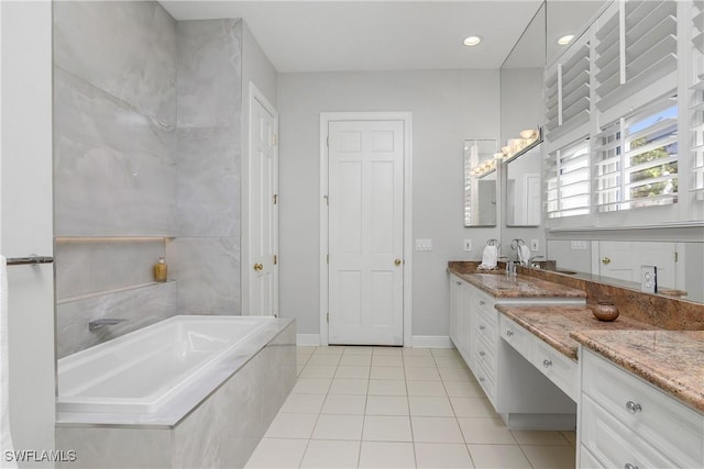 full bath featuring a garden tub, recessed lighting, vanity, baseboards, and tile patterned floors