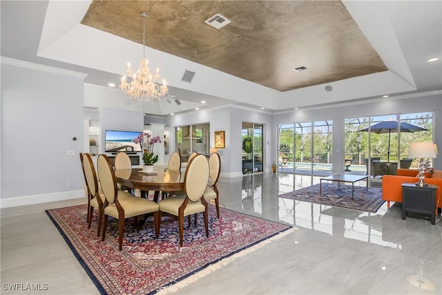 dining area featuring visible vents, baseboards, an inviting chandelier, crown molding, and a raised ceiling