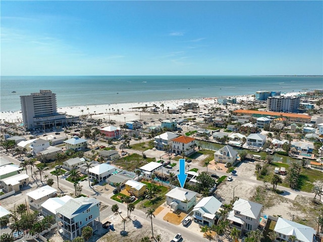 aerial view featuring a water view and a beach view