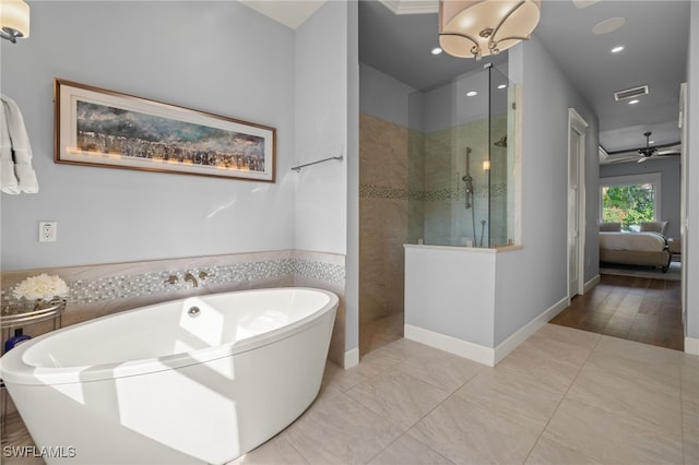 full bathroom featuring a soaking tub, visible vents, a ceiling fan, ensuite bath, and a walk in shower