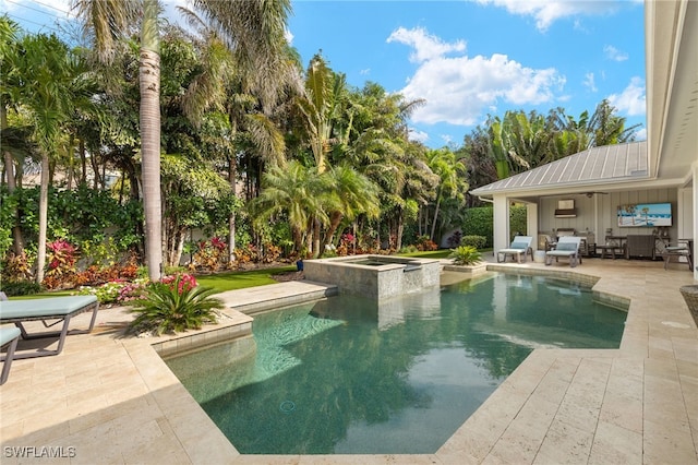 view of pool with a pool with connected hot tub, an outdoor living space, and a patio