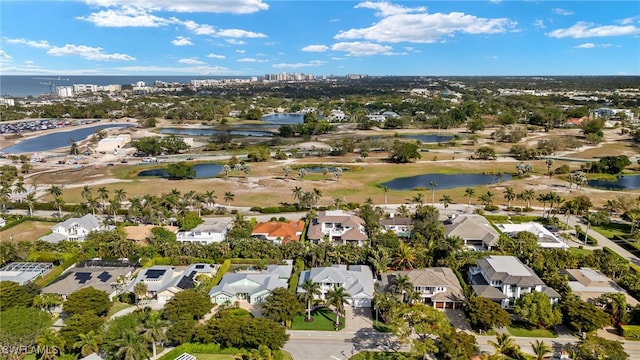 birds eye view of property featuring a water view and a residential view