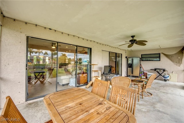 sunroom featuring ceiling fan