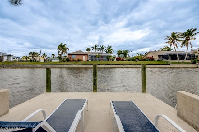 dock area with a water view and a residential view