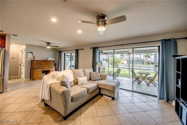 living room featuring recessed lighting, light tile patterned flooring, ceiling fan, and visible vents