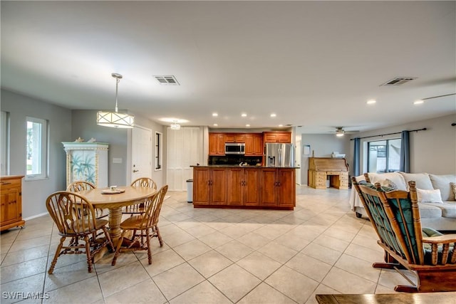 dining space with a ceiling fan, recessed lighting, visible vents, and light tile patterned floors