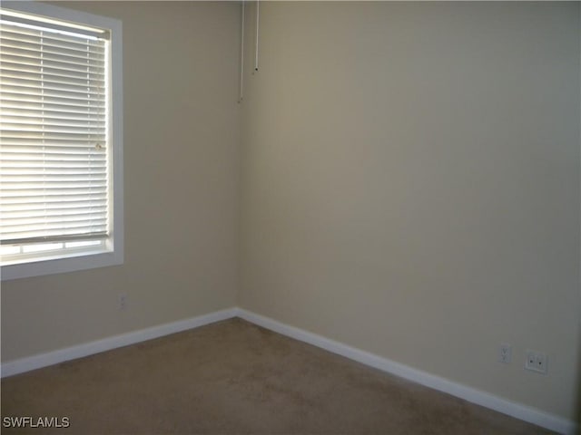 6210 Towncenter Cir, Naples, FL 34119 - carpeted spare room with baseboards