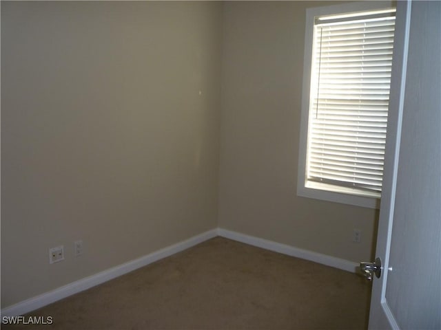 6210 Towncenter Cir, Naples, FL 34119 - empty room with carpet flooring and baseboards