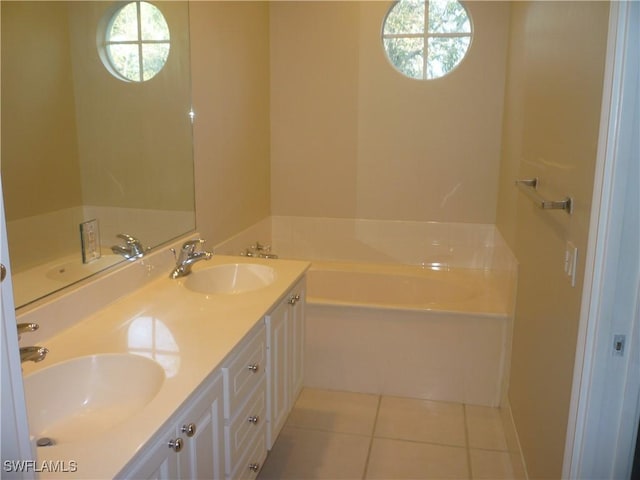 6210 Towncenter Cir, Naples, FL 34119 - full bath featuring a garden tub, tile patterned flooring, and a sink