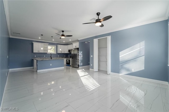 living room featuring crown molding, ceiling fan, and sink