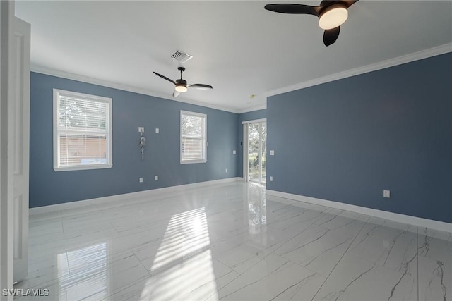 spare room with crown molding, a healthy amount of sunlight, and ceiling fan