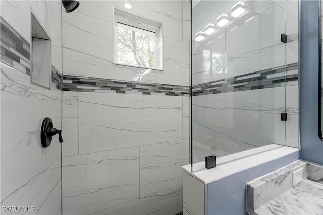 bathroom with a tile shower