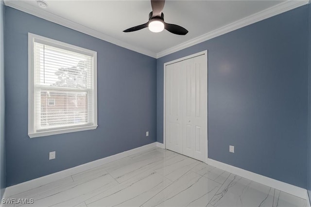 unfurnished bedroom featuring crown molding, a closet, and ceiling fan