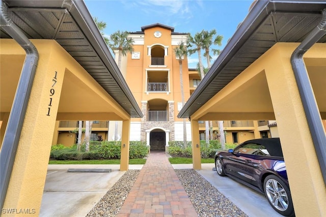 view of home's community featuring covered parking